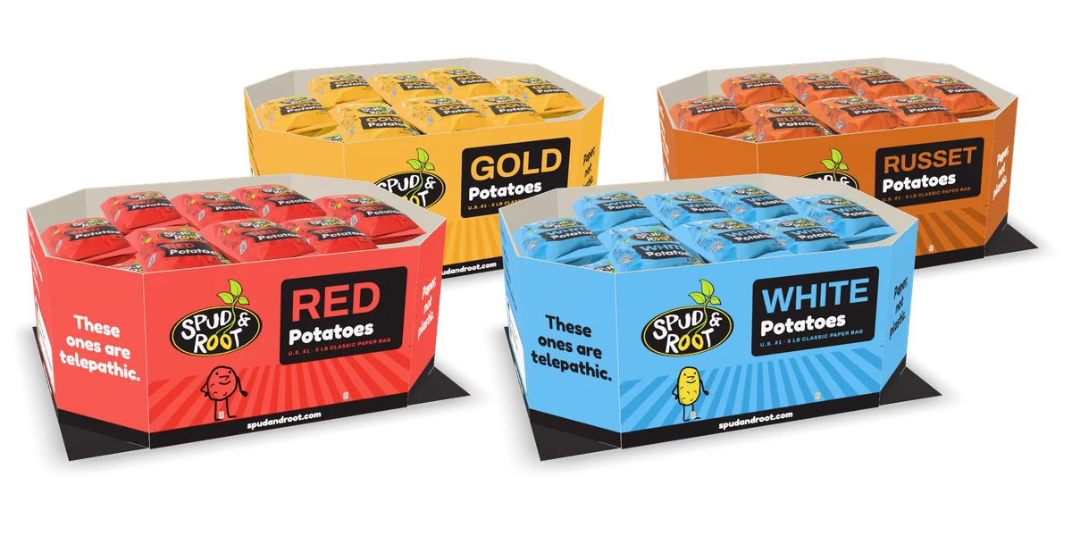 Four Spud & Root potato bins, in red, gold, russet and blue, each full of five-pound bags of its potato.